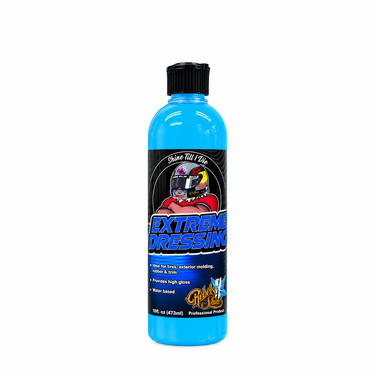 A 16oz bottle of Rebels of Shine Extreme Dressing, featuring a bright blue liquid, a black cap, and a black label with a red, white, and blue graphic.