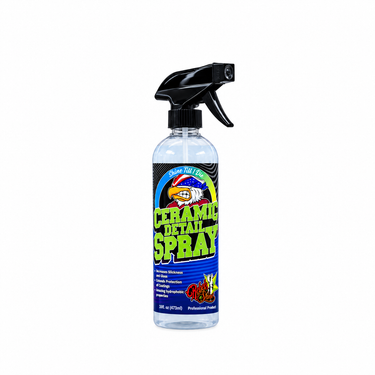 A 16oz white plastic bottle of Rebels of Shine Ceramic Detail Spray with a black cap and a colorful black label featuring green text and a hawk logo.