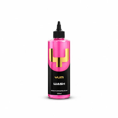 Bottle of YUM Wash on a pink background