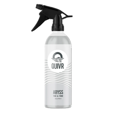 A 32 oz spray bottle of QUIVR Abyss Tire & Trim cleaner, featuring a clear bottle, white label, and black trigger spray nozzle, set against a plain white background.