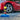 Red car with a bottle of Stoner Tar & Sap Remover and a blue towel on the ground.