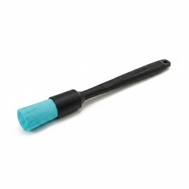 Black brush long handle with blue stiff bristles on a white background