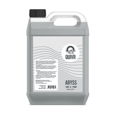A 1 gallon jug of QUIVR Abyss Tire & Trim cleaner, featuring a clear bottle, white label, and black trigger spray nozzle, set against a plain white background.