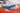 a Blue and a pink microfiber towel on a car hood